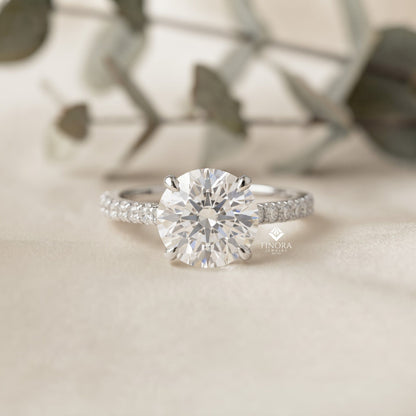 Round Brilliant Moissanite Engagement Ring with Pavé Diamond Band – Classic Four-Prong Solitaire in White, Yellow, or Rose Gold | Finora Jewelry