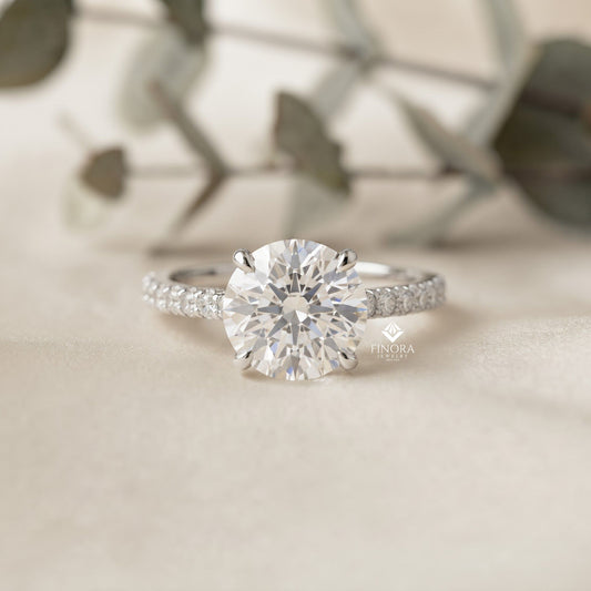 Round Brilliant Moissanite Engagement Ring with Pavé Diamond Band – Classic Four-Prong Solitaire in White, Yellow, or Rose Gold | Finora Jewelry