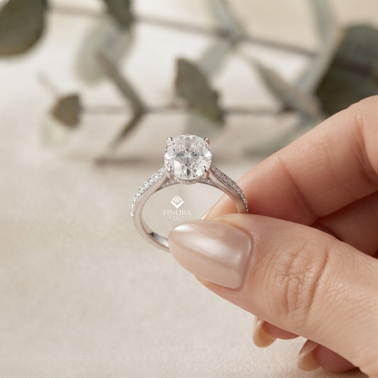 Elegant Oval Cut Engagement Ring with Diamond-Accented Band – Timeless Gift for Her – Classic Solitaire Setting in White Gold, Platinum or Silver – Finora Signature Sparkle