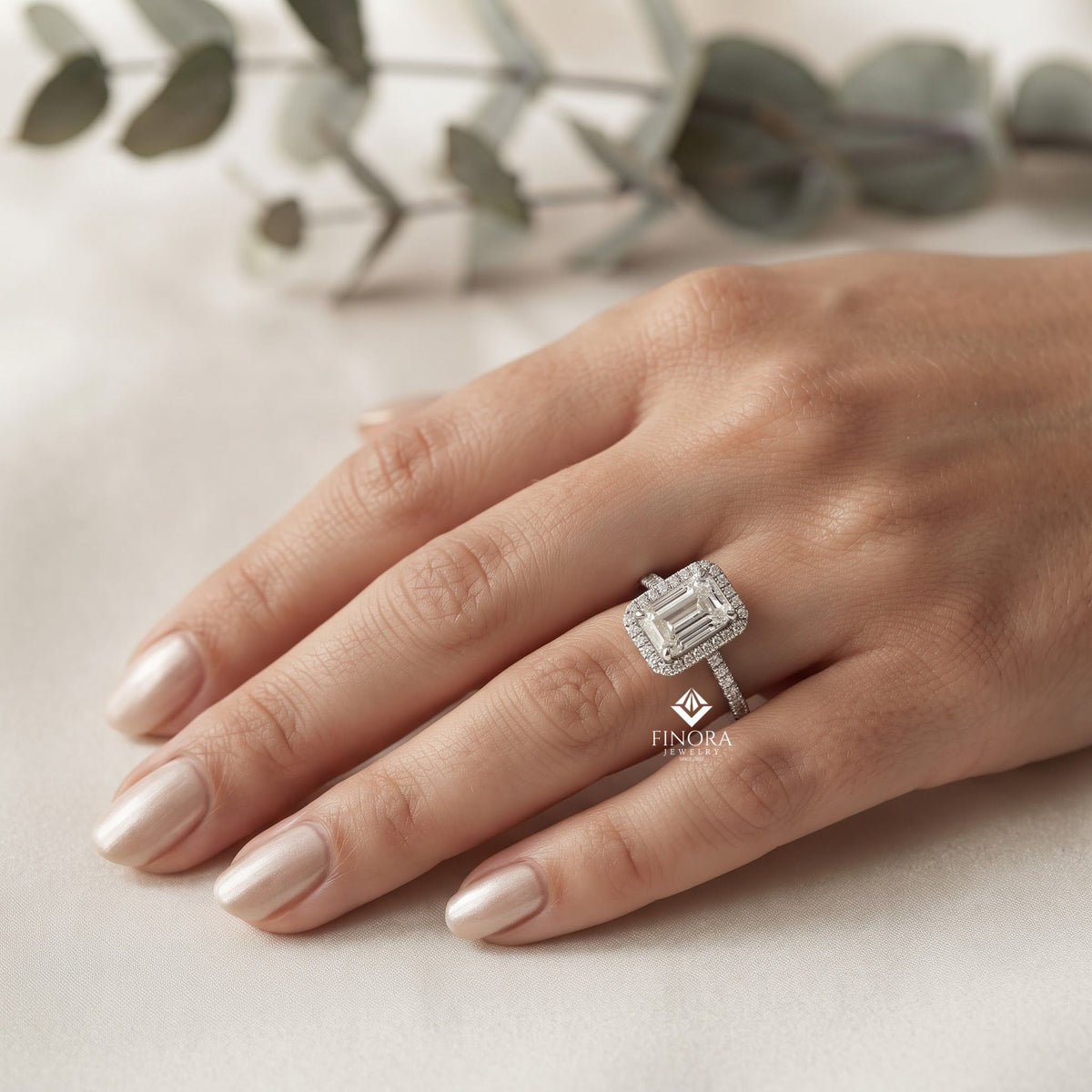 emerald cut halo ring with diamond accents by finora jewelry