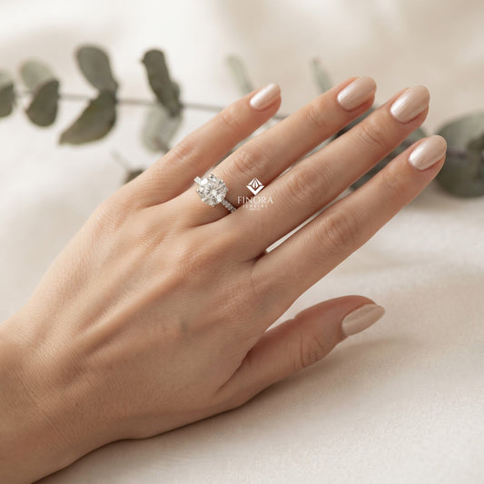 Round Brilliant Moissanite Engagement Ring with Pavé Diamond Band – Classic Four-Prong Solitaire in White, Yellow, or Rose Gold | Finora Jewelry