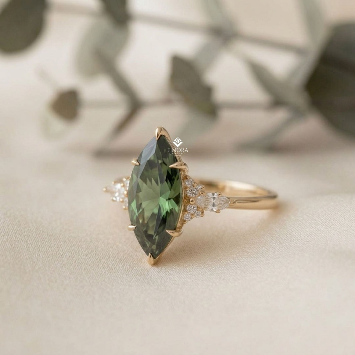 green marquise cut engagement ring – gold cluster design, everyday elegance