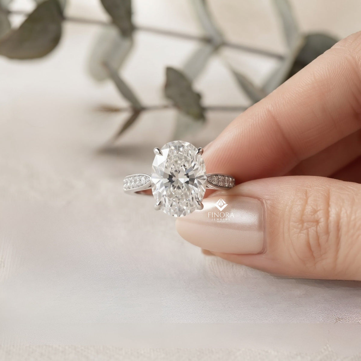 elegant oval cut engagement ring with diamond-accented band – timeless gift for her – classic solitaire setting in white gold, platinum or silver – finora signature sparkle