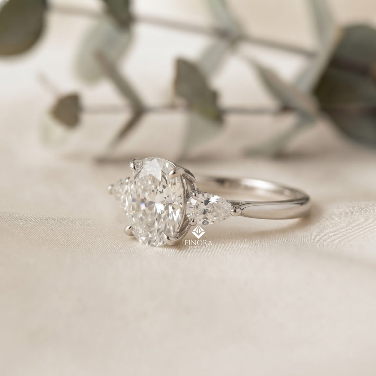 1.67 ct oval cut moissanite three stone engagement ring with pear side stones | 925 silver & 10k/14k gold | finora jewelry