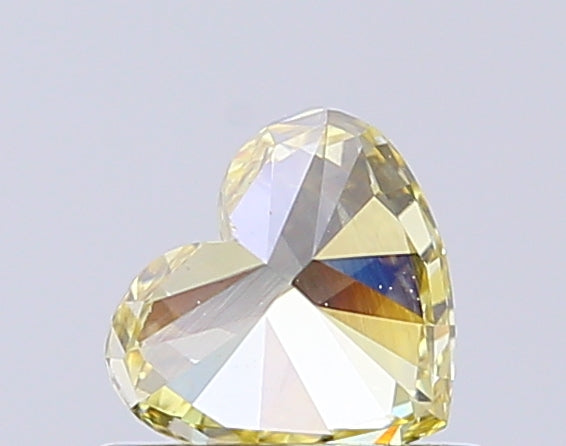 heart cut 0.65 ct igi certified fancy intense yellow diamond – finora jewelry