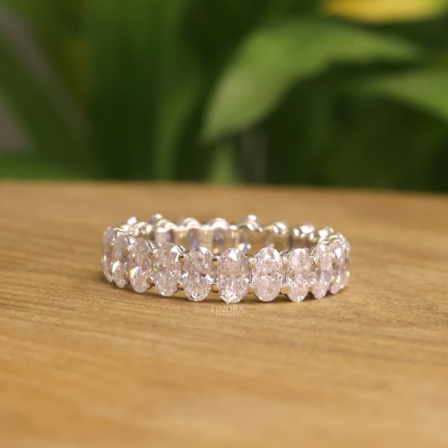 oval cut moissanite eternity wedding band in 925 sterling silver / 10k & 14k gold