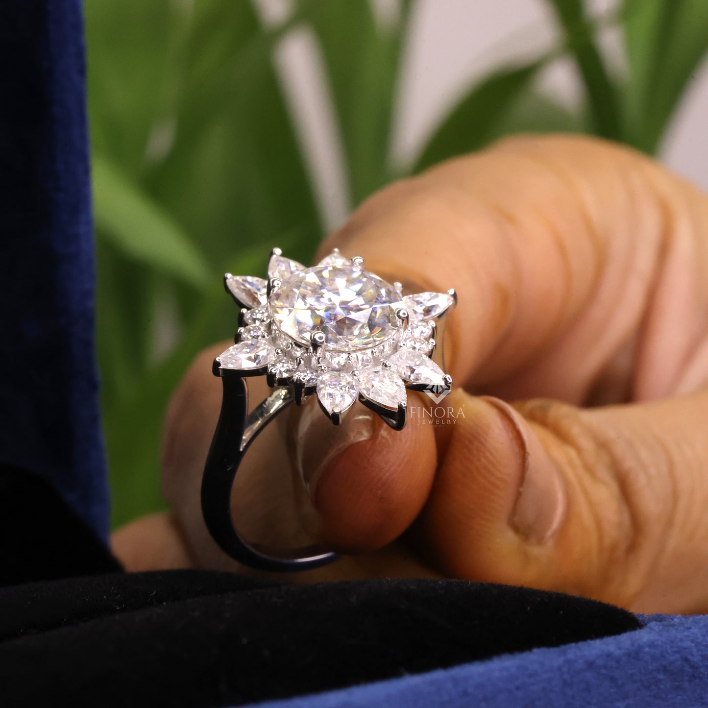 5.41 ct round cut moissanite halo engagement ring with pear & round side stones | finora jewelry